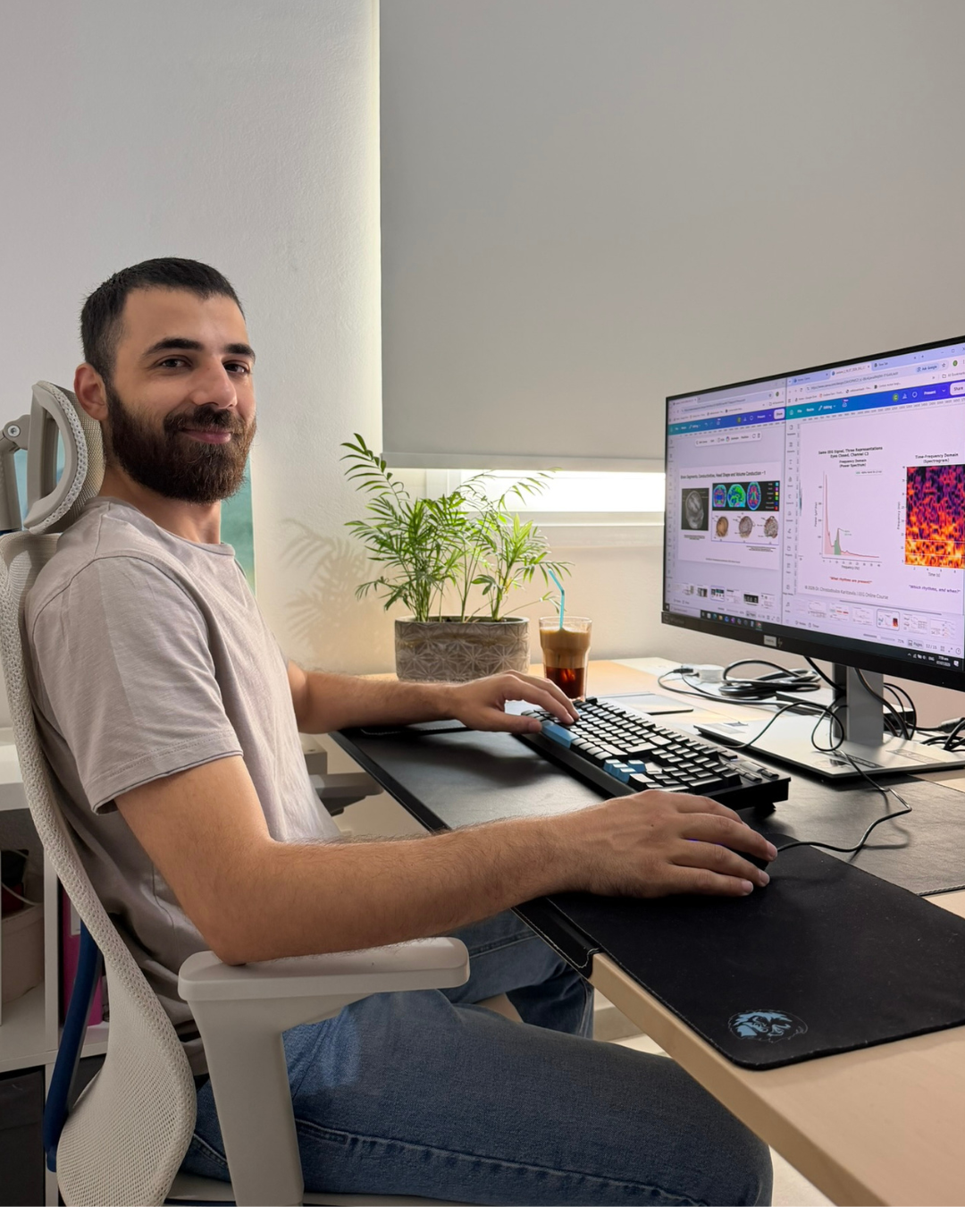 Chris Karittevlis at his desk analysing brain recordings